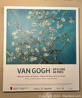 Photo of framed Van Gogh Almond Blossom art poster with exhibition text from National Gallery of Canada.