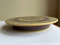 Side profile of the platter showing the raised base and side pattern.