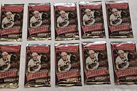 Lot of ten sealed 2009-10 Upper Deck Hockey Victory card packs shown arranged flat and unopened, factory sealed.