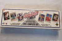 Photo of the sealed box showing the full front view with product title and images of sample player cards along with product details.