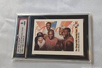 Front view of the graded 1991-92 Skybox Bulls starting team basketball card number 337 showing five players including Michael Jordan and grading label of 8 NMM (near mint/mint).