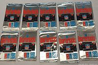 10 foil sealed trading card packs from 1991 Domino's Pizza NFL The Quarterbacks Challenge series, front view showing branding and design.