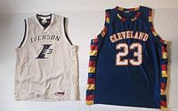 Photo showing both Iverson and Cleveland basketball jerseys side by side for comparison
