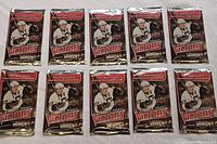 Top view of 10 factory sealed 2009-10 Upper Deck Hockey Victory card packs laid out in two rows of five.