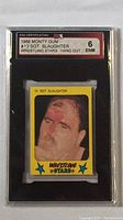 Front view of 1986 Monty Gum Sgt Slaughter #13 hand-cut wrestling card graded ENM 6 by KSA Certification.