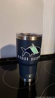 Front angled view of the Yeti Fish Hippie insulated tumbler showcasing logo and blue matte finish.
