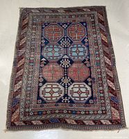 Full view of the area rug showing overall design and condition