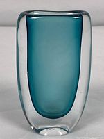 Front view showing teal inner core encased in clear glass