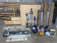 Overview of all equipment including stands, reflectors, lights and accessories arranged on floor