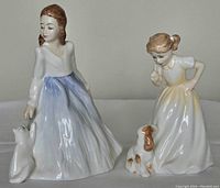 Two Royal Doulton figurines Andrea (5 inch) and Sit (4.25 inch) shown from the front on white background.