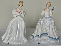 Two Royal Doulton porcelain figurines positioned side by side on a neutral background, showing both figures fully for size and detail comparison.