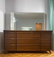 Front view of walnut dresser with attached mirror