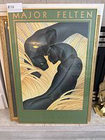 Full frontal view of the framed Major Felten poster with panther figures and text.