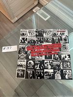 Top view of the box set with collage of Rolling Stones singles artwork and red text.