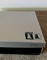 Original silver top and black bottom box with “chess” logo and two piece silhouettes; “A Carlton Product Made in England” printed on side