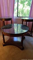 Set of three tables showing two side tables and one coffee table with green stone tops and dark wood legs.
