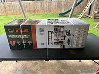Box of Haus 59-piece Garage System Kit with branding and high-quality claim.