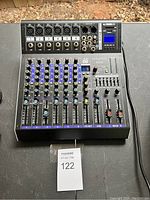 Front view showing all controls, input/output ports, and USB slot with visible labeling.