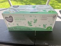 Front view of unopened Parent's Choice baby wipes box showing brand, type fragrance free baby wipes, quantity 800 wipes in 8 packs, dimensions of wipes.