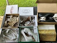 Top view of the lot including various women's shoes and a gold Michael Kors clutch purse