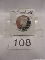 Front view of the 1995-S Kennedy half dollar silver proof coin inside plastic holder with label '1995-S silver proof'.