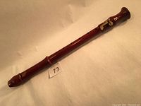 Full view of assembled alto recorder showing the wooden body and metal keys.