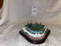 Angle showing front and side of the Comiskey Park model with its detailed stands and base.