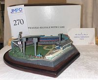 Front view of the Danbury Mint Forbes Field baseball stadium model in front of its original box and inspection card.
