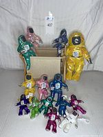 Front view showing all 14 figures of various sizes along with the collapsible canvas storage holder.