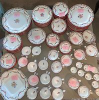 Overhead view of stacked plates, bowls, cups and saucers with sticky-note counts