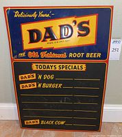 Full front view of the Dad's Old Fashioned Root Beer metal sign with blackboard specials section showing overall condition and graphics.