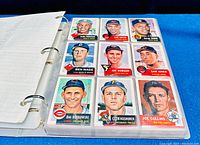Three ring binder containing baseball cards from the 1991 Topps Archives 1953 set, sleeved in clear plastic sheets.