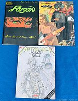 Three guitar tab books for band music, showing front covers of Poison, Green Day, and Metallica albums.