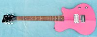 Front view showing full length of pink electric guitar with white humbucker pickup, two control knobs, rosewood fretboard, and black headstock with tuning pegs.
