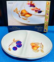 Photo of Royal Worcester Evesham Gold divided dish in original box; dish shows colorful fruit design and gold rim.