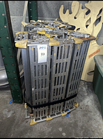 Folded segmented ramps strapped together in storage position