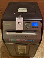 Front view of the GoECOlife shredder showing slot for paper input, brand stickers and overall condition.