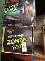 Two original cardboard boxes: Spirit Flesh Eating Zombie and sound-activated Zombie Bait