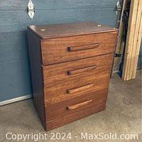 Full view of the vintage solid wood dresser with three drawers.