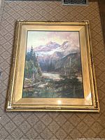 Full view of framed watercolour painting depicting mountainous landscape