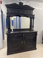 Full view of the Victorian carved oak sideboard with mirror showing intricate carvings and overall condition.