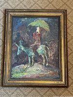 Full view of vintage abstract oil painting on panel of figure with umbrella riding horse or donkey in gold-tone frame showing wear.