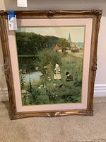 Full view of framed painting showing two children in grass near a pond and village in the background
