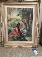 Full view of the framed painting showing two girls in a meadow in impressionist style.