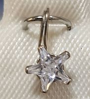 Close-up image of the 10K gold star-shaped cubic zirconia pendant showing the gemstone and gold setting.