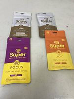 Four packs of patches by The Super Patch Company including Focus, Joy, and Lumi variants, pictured on white background.