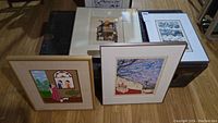 All four framed art pieces, showing different scenes and frame styles