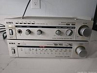 Photo of the front of the vintage Aiwa amplifier model A10 showing controls and headphone jack