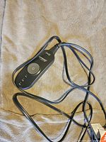 Photo of the Sunbeam heated sheet's controller showing power and heat setting buttons to control the temperature.