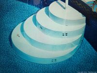 Photo of white curved stairs shaped like a cake step for an above ground pool, showing three wide steps and ventilation holes.